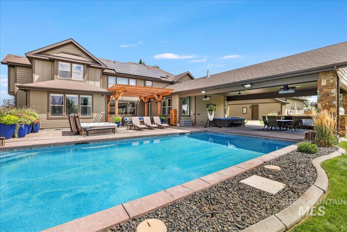 3365 Willow Way Twin Falls, ID 83301 - Photo 34 of 50 Swimming pool featuring a hot tub, a patio area, and a pergola