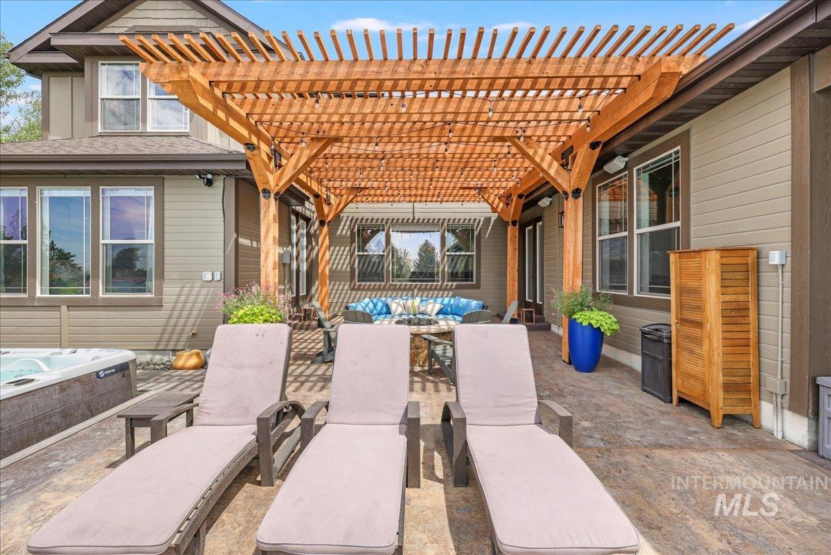 3365 Willow Way Twin Falls, ID 83301 - Photo 41 of 50 View of patio / terrace featuring a pergola, a hot tub, and outdoor lounge area