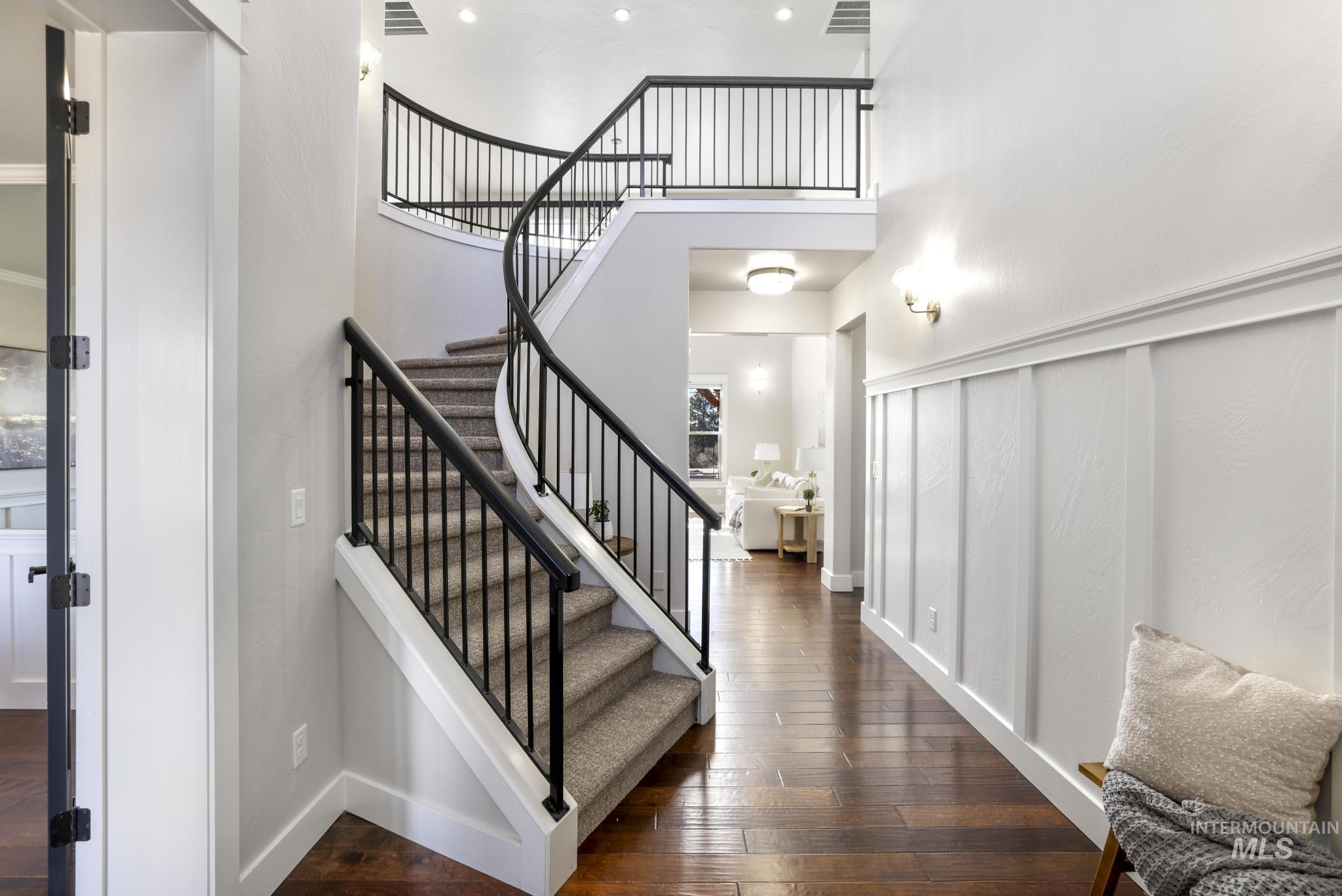 3365 Willow Way Twin Falls, ID 83301 - Photo 9 of 50 Staircase featuring hardwood / wood-style flooring and a high ceiling