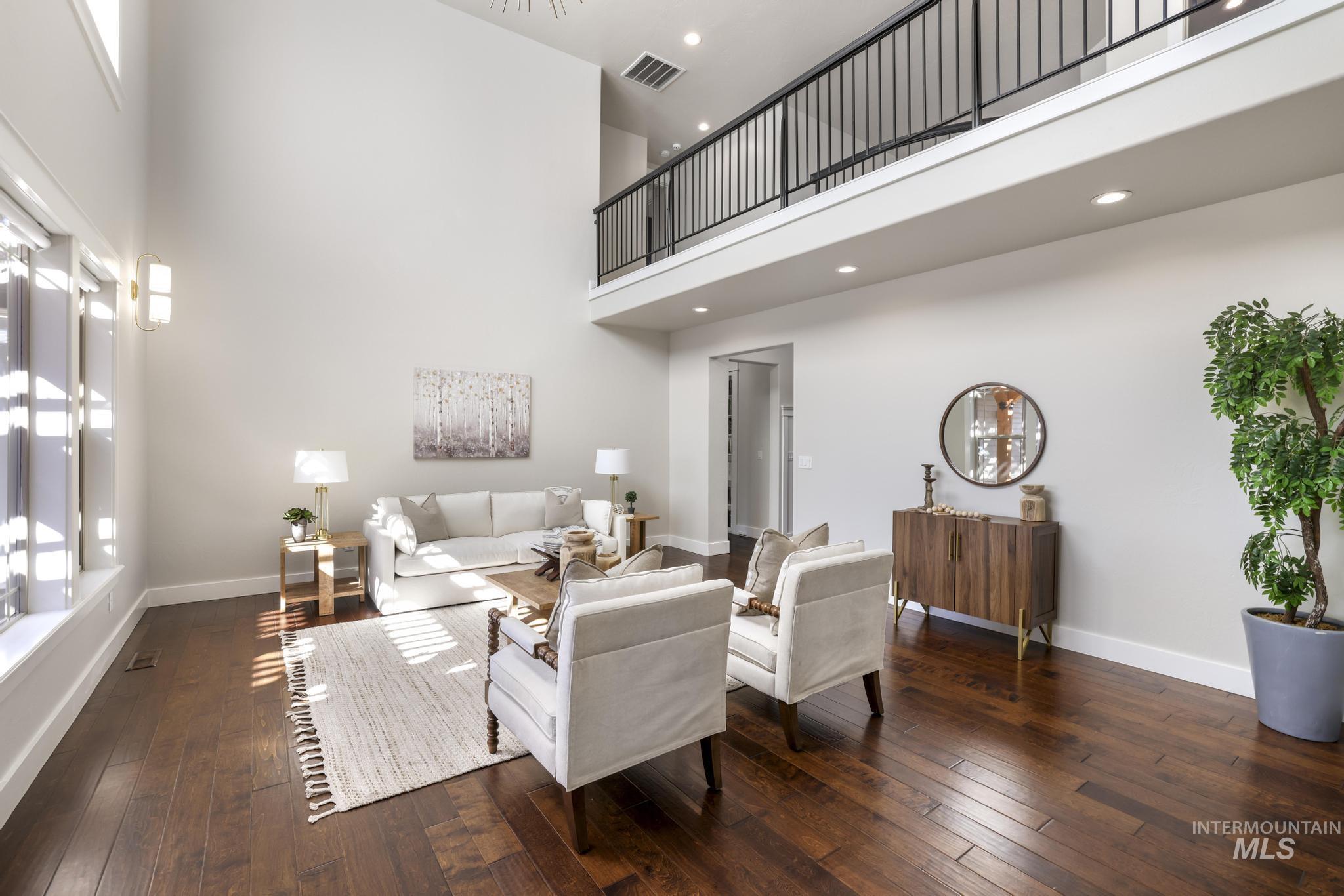 3365 Willow Way Twin Falls, ID 83301 - Photo 10 of 50 Living room featuring dark wood-style flooring, a high ceiling, and recessed lighting