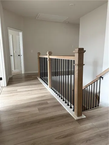 a bathroom with a toilet a sink a vanity and mirror