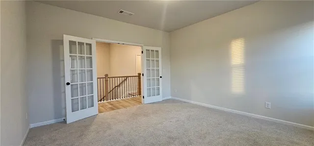 an empty room with windows