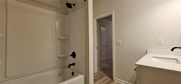 a bathroom with a sink and a shower