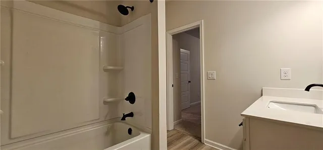 a bathroom with a sink and a shower