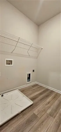 a view of a room with wooden floor