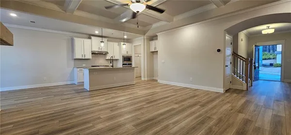 a view of a kitchen with a sink and a stove