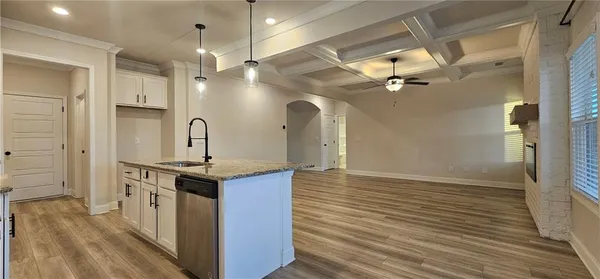 a kitchen with stainless steel appliances granite countertop a stove and a refrigerator