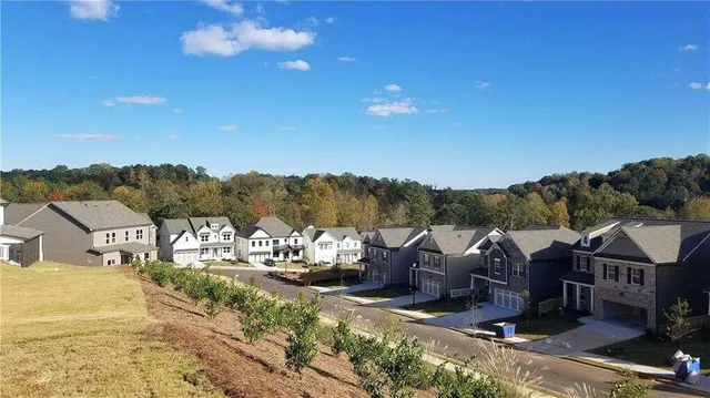 a view of a town with mountains in the background