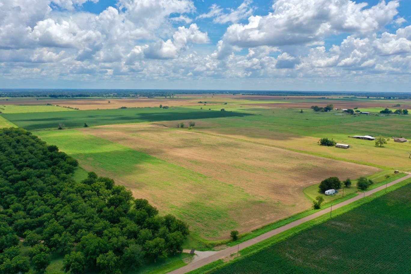 0 South County Road Eagle Lake, TX 77434 - Photo 21 of 26 a view of a big yard with lots of green space and mountain view