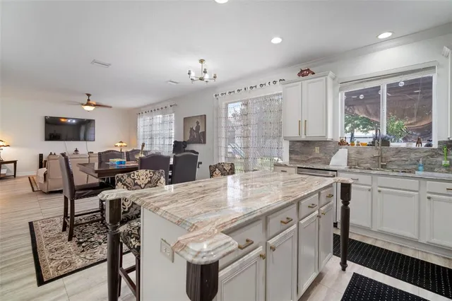a view of a livingroom with furniture and a chandelier