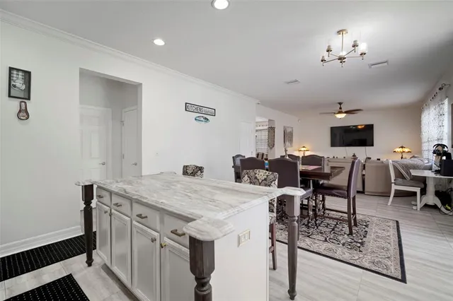 a kitchen with a sink stove and refrigerator