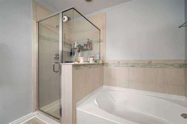 a bed room with a bed window and a chandelier