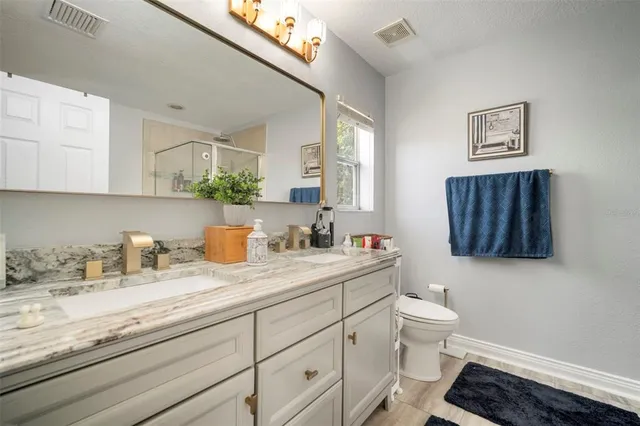 a bedroom with baby bed and a window