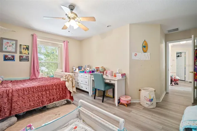 a bathroom with a double vanity sink toilet and a mirror