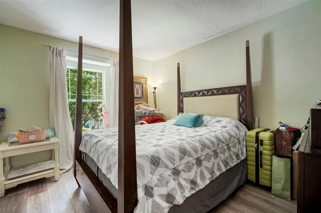 an aerial view of a house with a yard and lake view