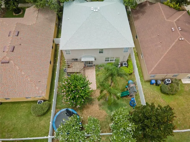 an aerial view of residential building and lake