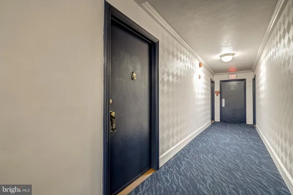 a view of hallway with wooden floor