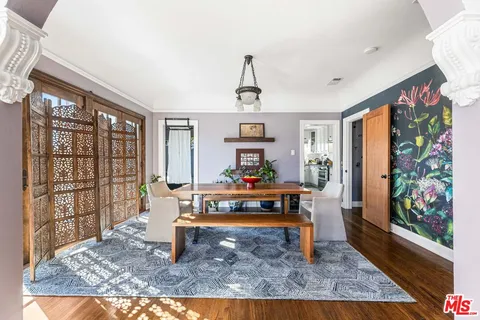 a living room with furniture rug and window