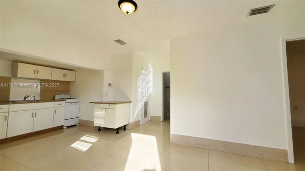 a room with lot of cabinets and wooden floor