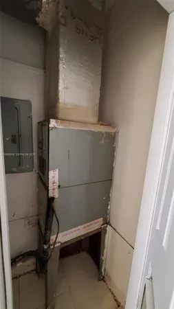 a view of storage and utility room with racks on the wall