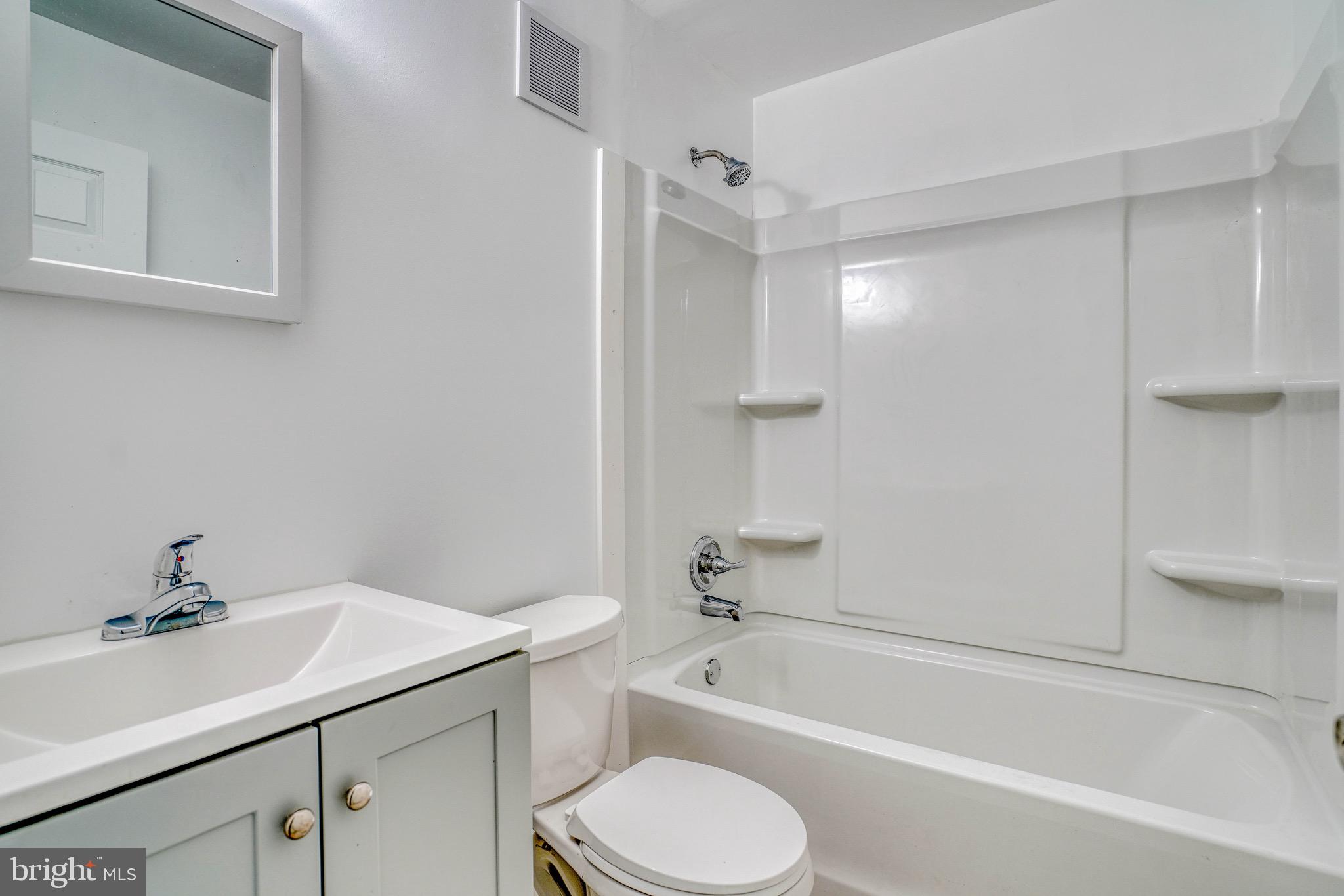 10203 East Keswick Road, Unit 1 Philadelphia, PA 19114 - Photo 17 of 23 a bathroom with a sink toilet and bathtub