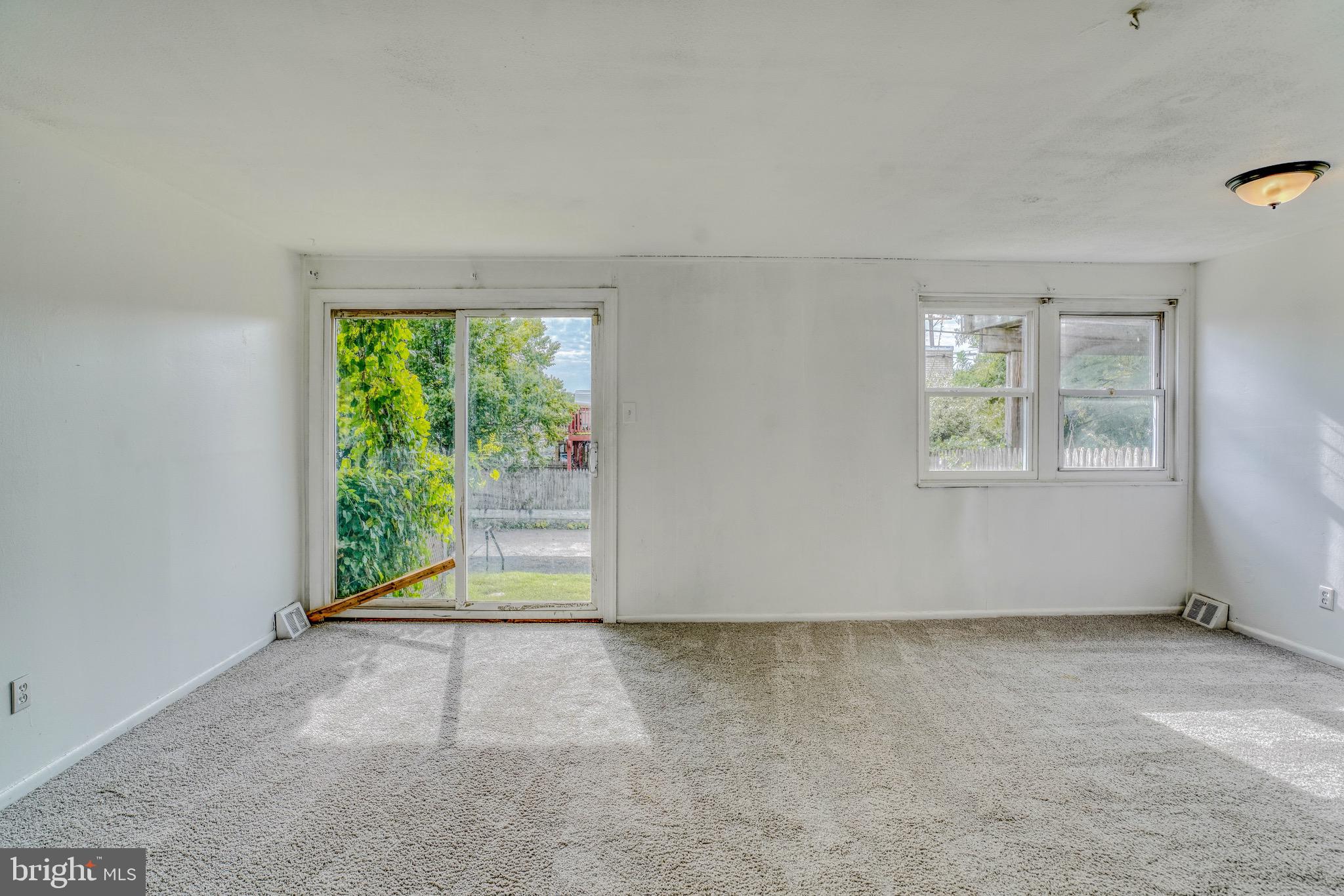 10203 East Keswick Road, Unit 1 Philadelphia, PA 19114 - Photo 4 of 23 an empty room with windows