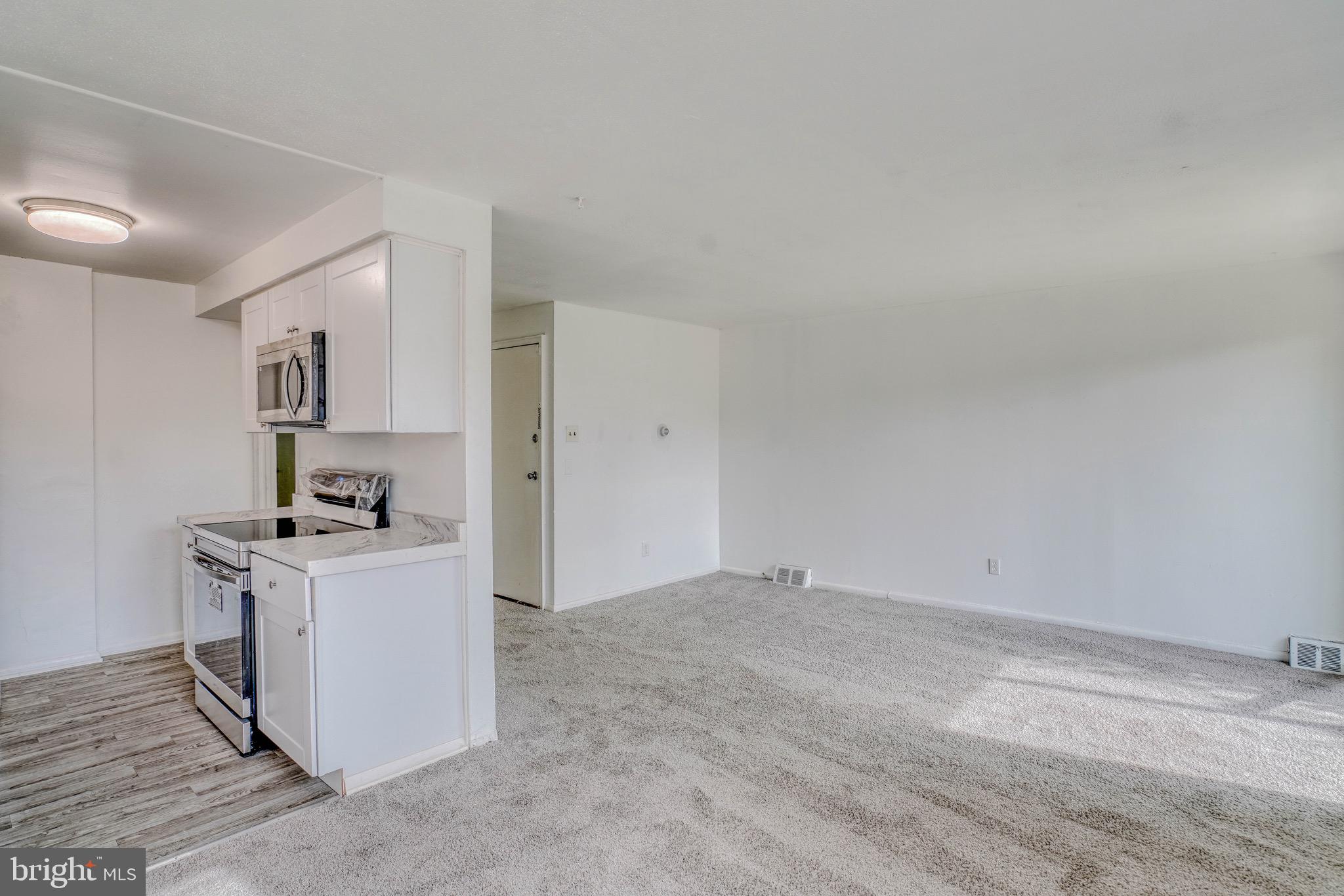 10203 East Keswick Road, Unit 1 Philadelphia, PA 19114 - Photo 9 of 23 a view of a kitchen with a sink and a stove top oven