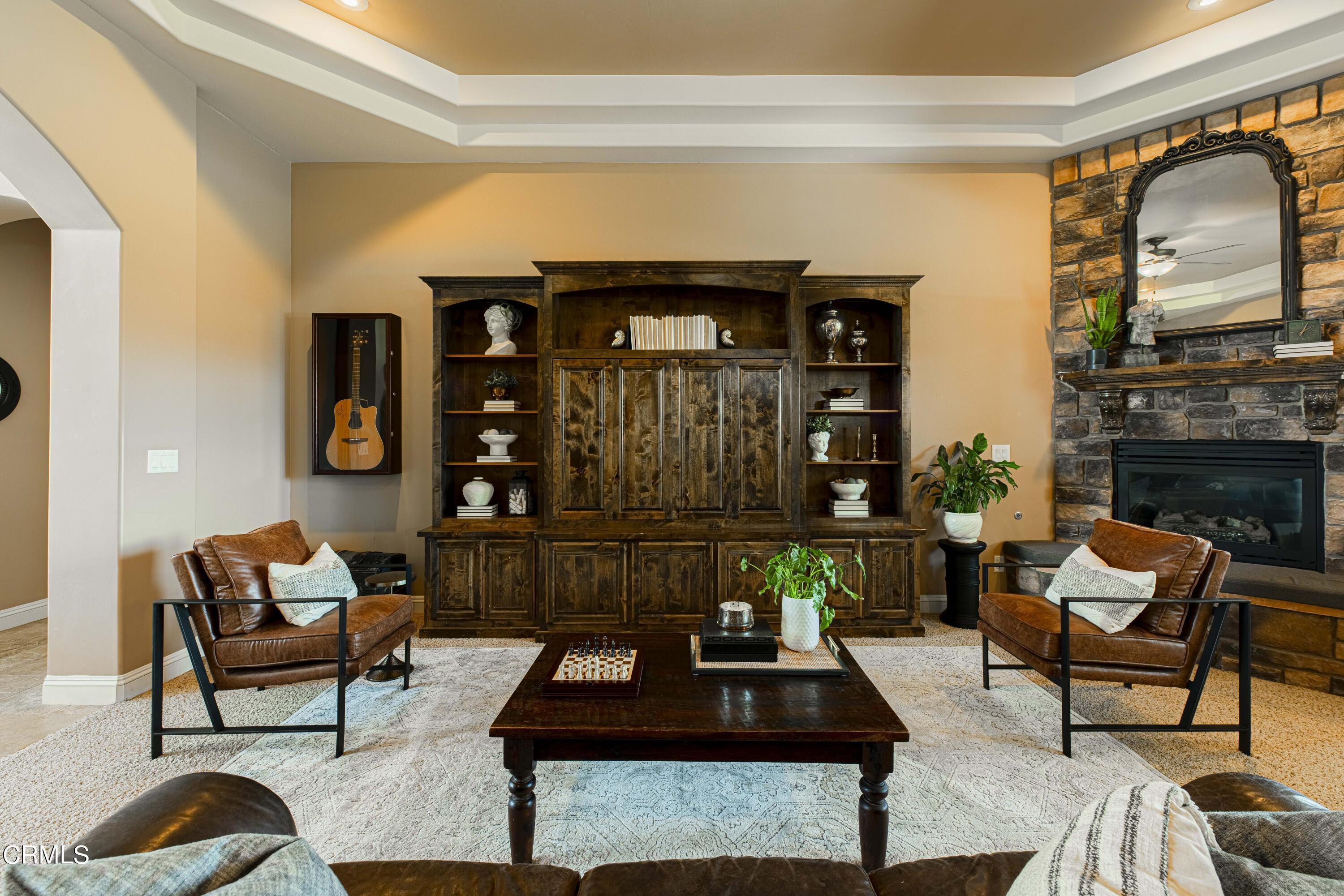 15023 Redwood Pass Drive Bakersfield, CA 93314 - Photo 12 of 67 a living room with furniture and a fireplace