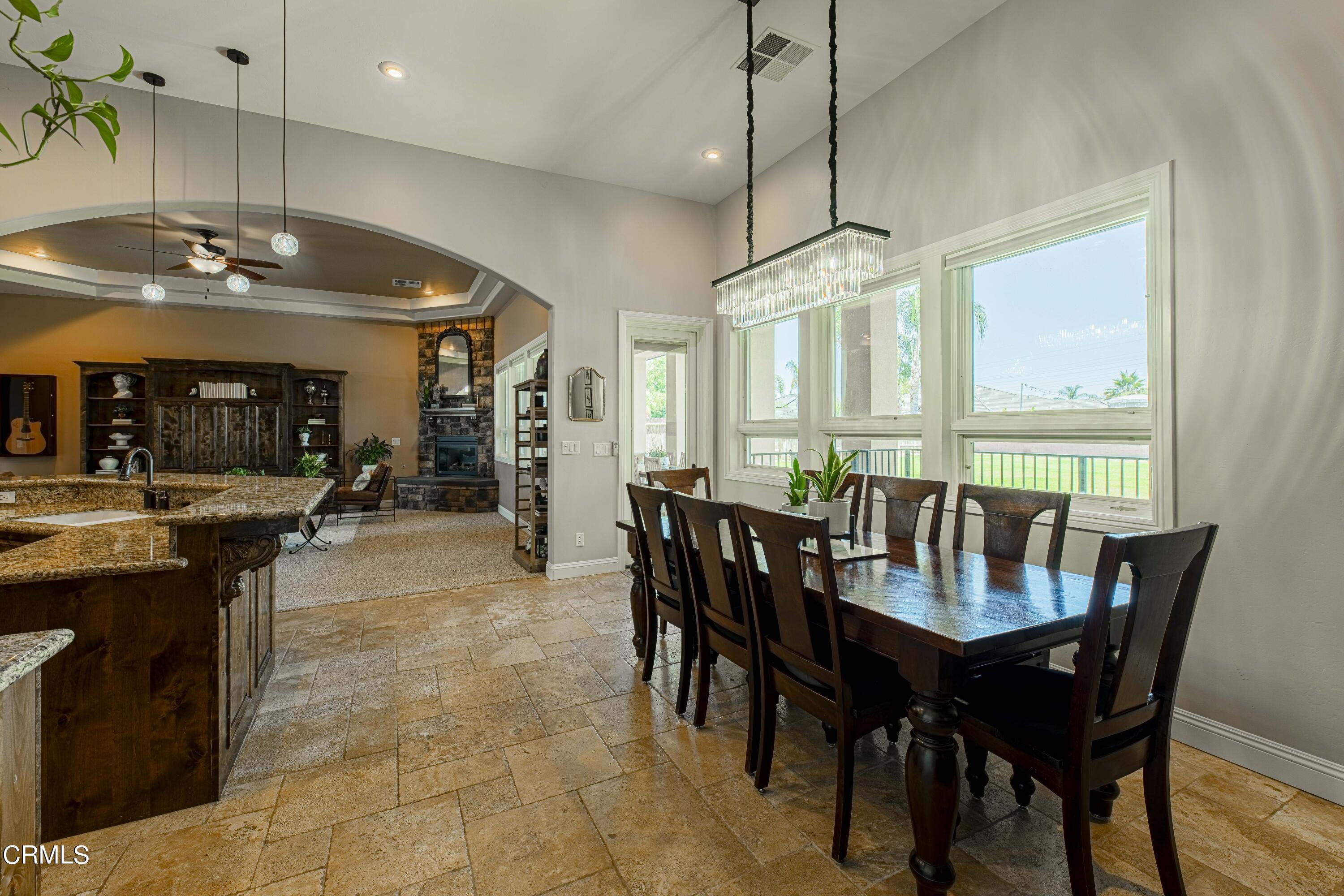 15023 Redwood Pass Drive Bakersfield, CA 93314 - Photo 17 of 67 a view of a dining room with furniture window and outside view