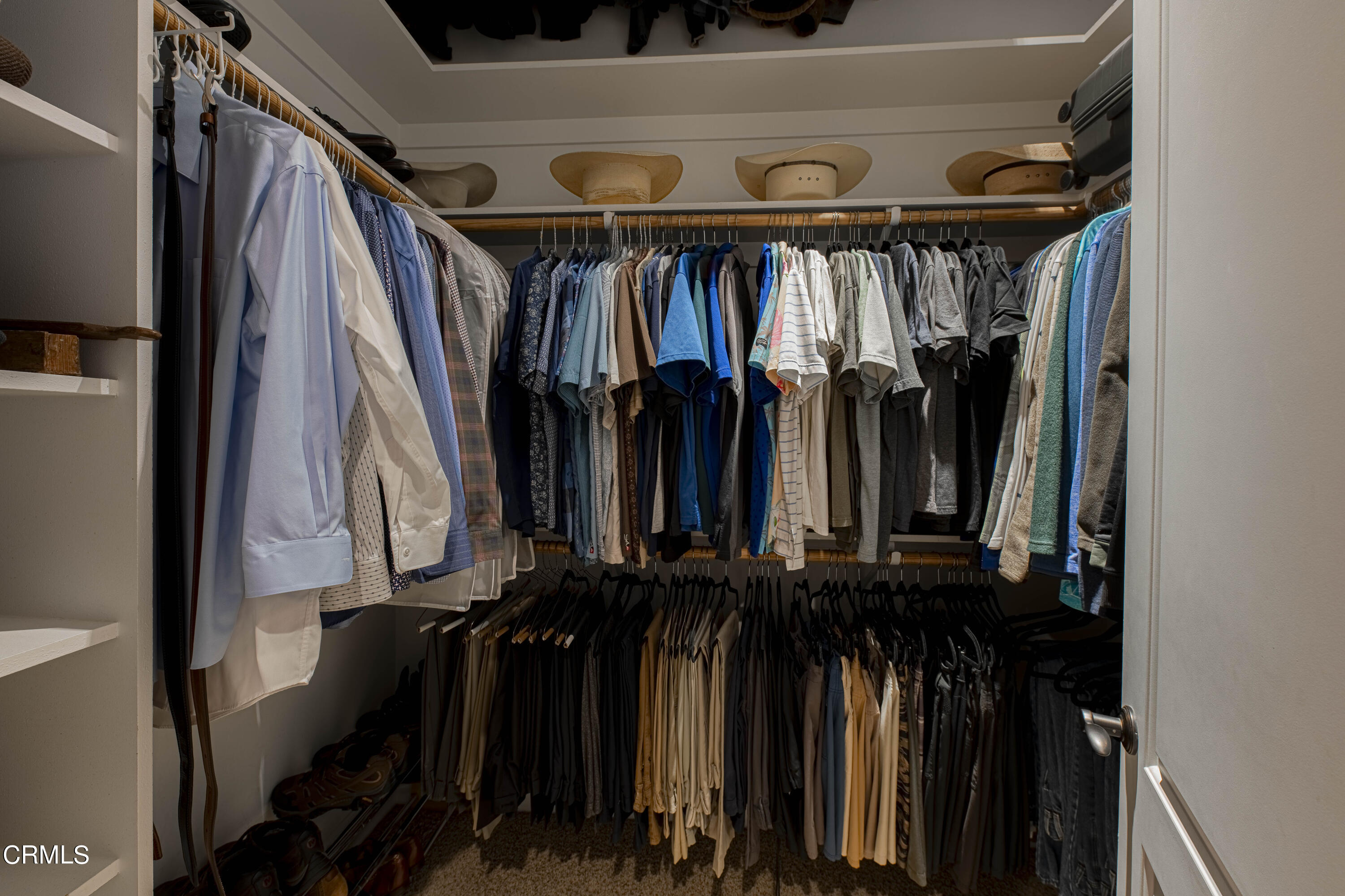 15023 Redwood Pass Drive Bakersfield, CA 93314 - Photo 29 of 67 a view of walk in closet with clothes and shoes