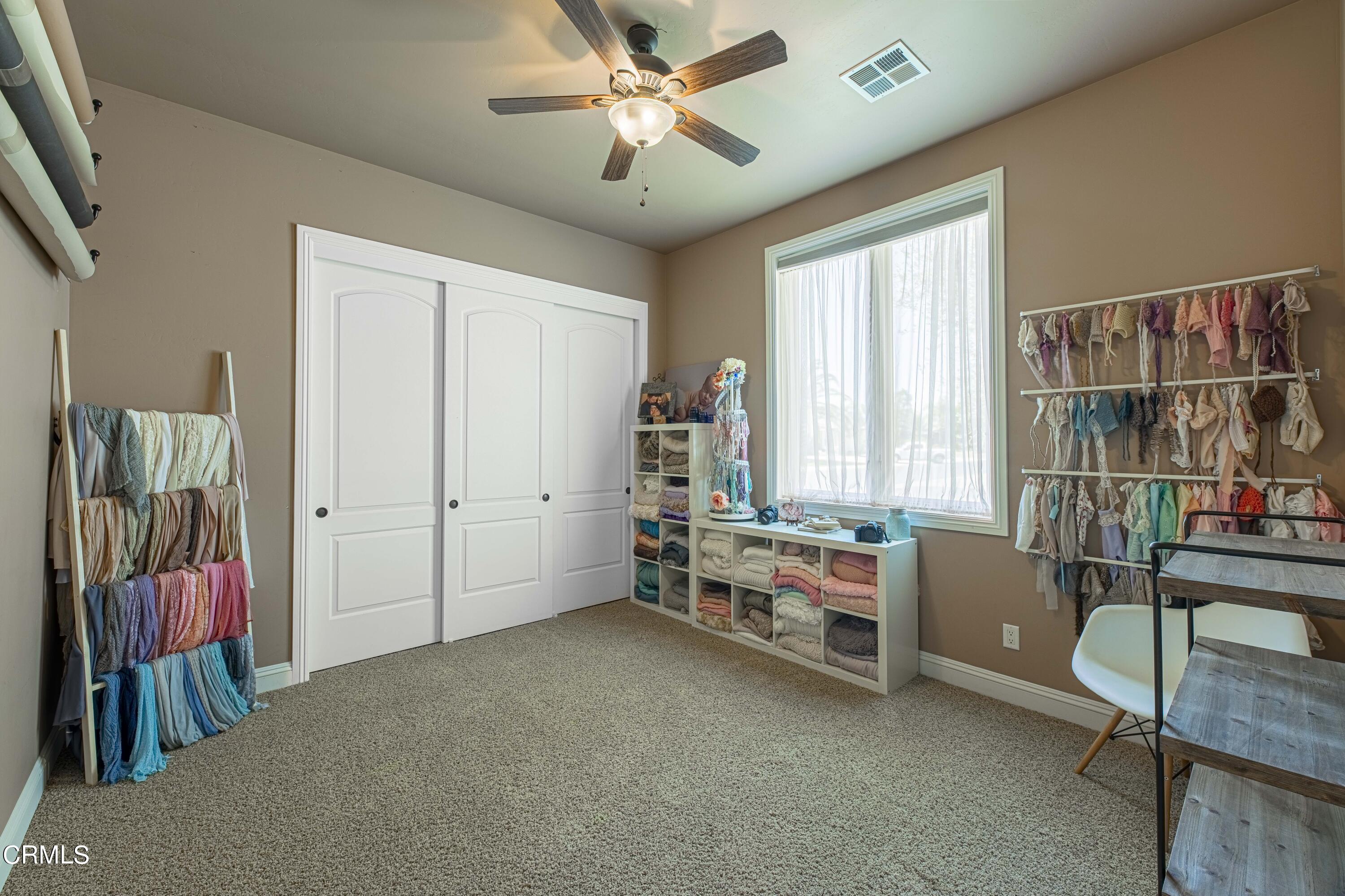 15023 Redwood Pass Drive Bakersfield, CA 93314 - Photo 33 of 67 a bedroom with furniture and a window