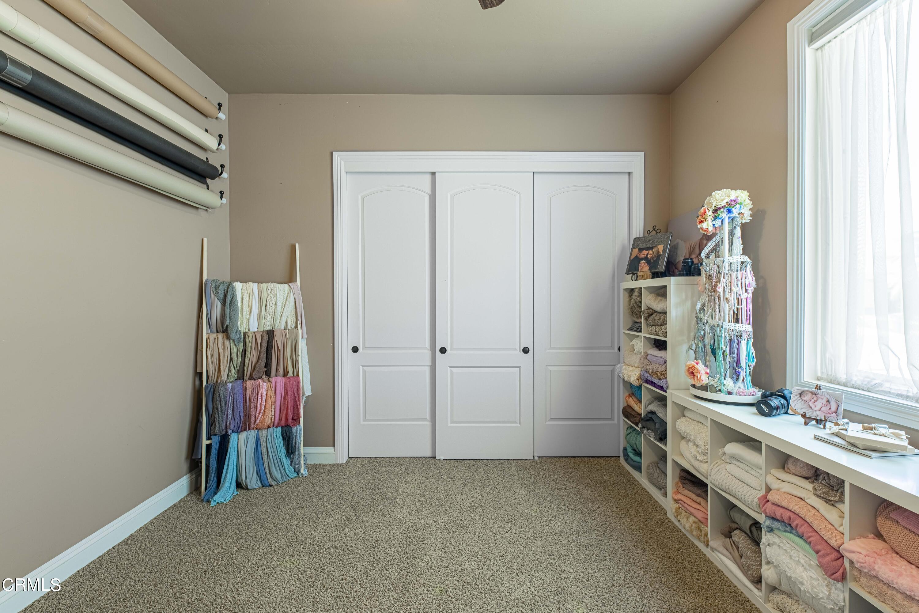 15023 Redwood Pass Drive Bakersfield, CA 93314 - Photo 34 of 67 a view of room with baby crib and toys