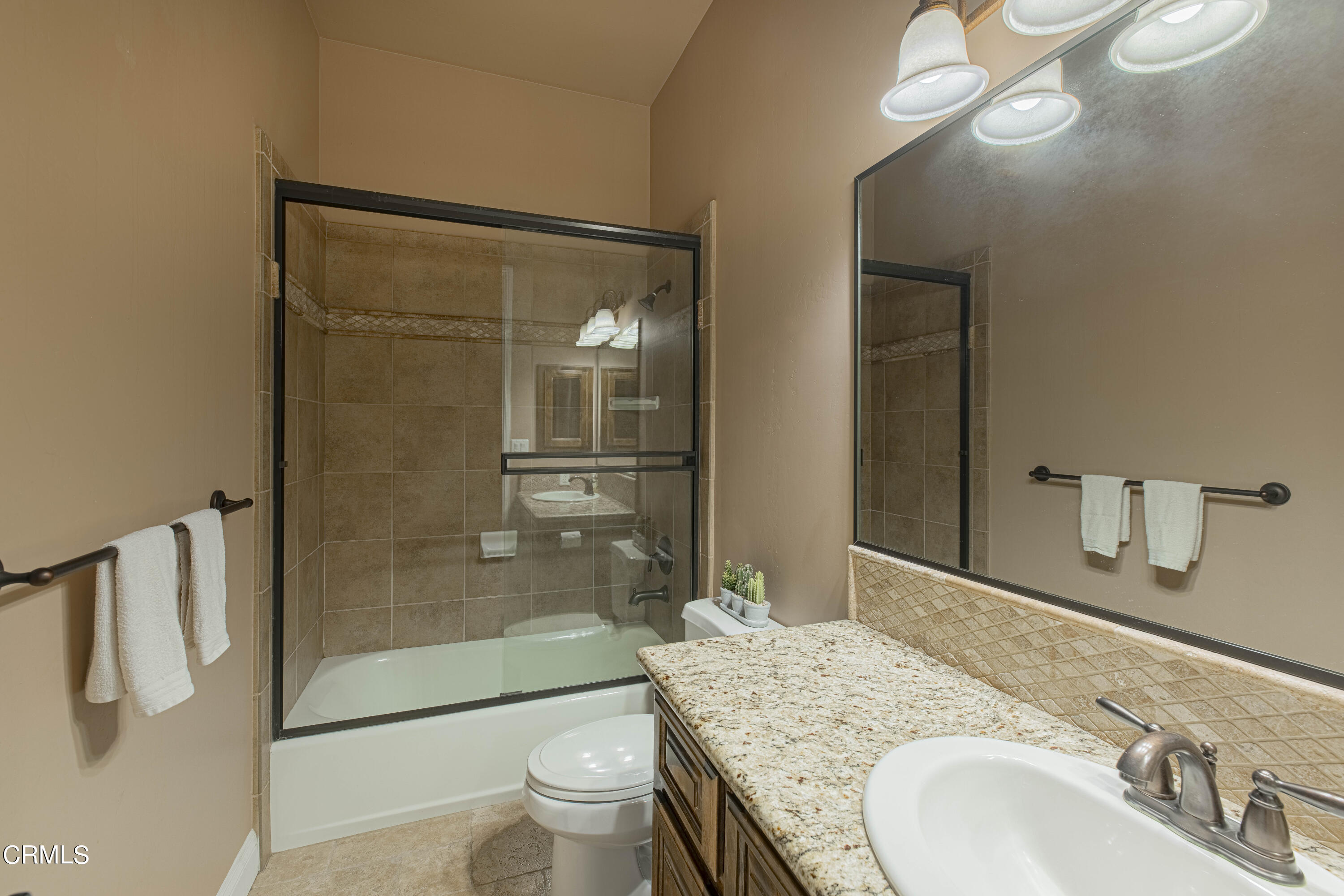 15023 Redwood Pass Drive Bakersfield, CA 93314 - Photo 35 of 67 a bathroom with a granite countertop sink toilet and shower