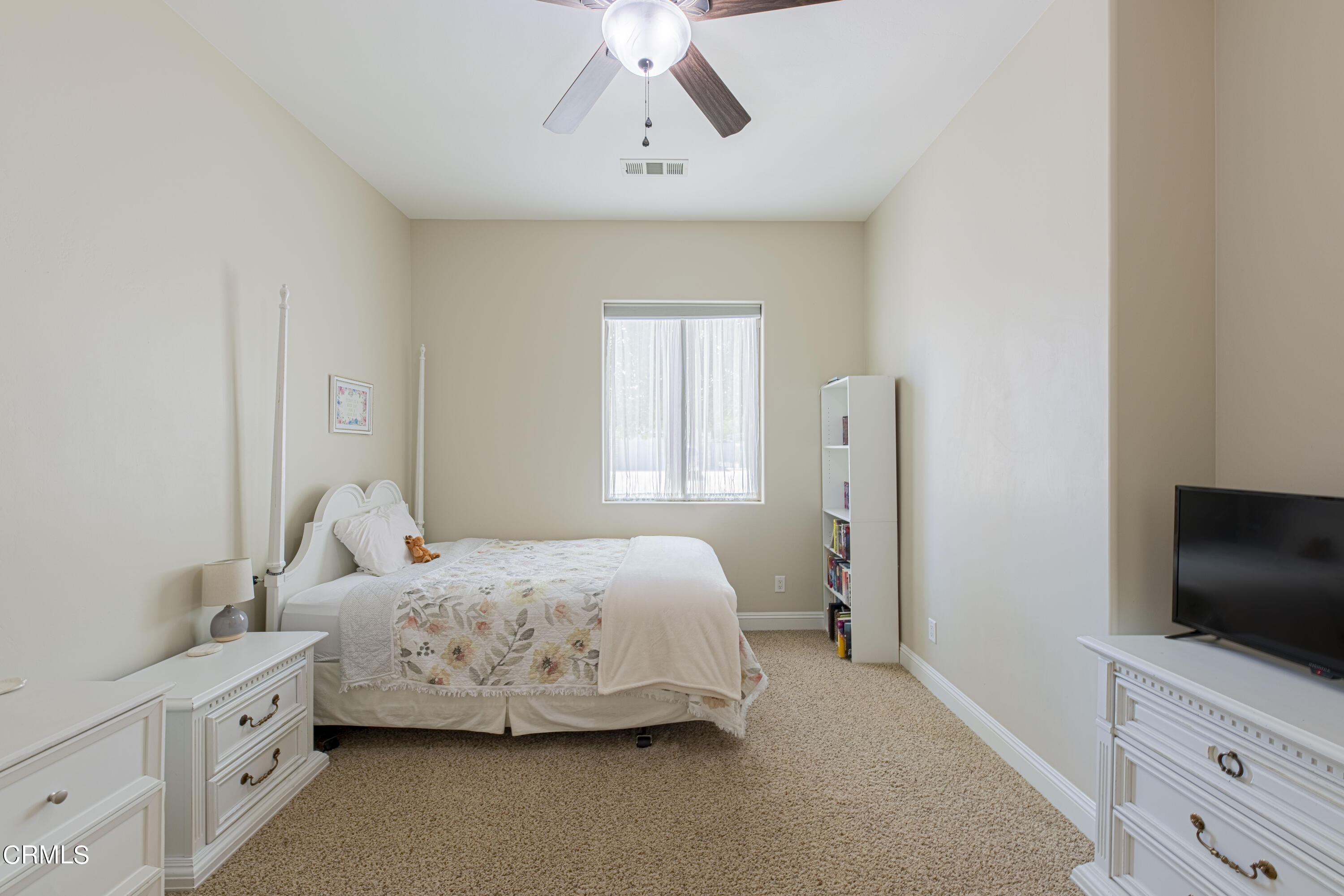 15023 Redwood Pass Drive Bakersfield, CA 93314 - Photo 39 of 67 a bedroom with a bed and a flat screen tv