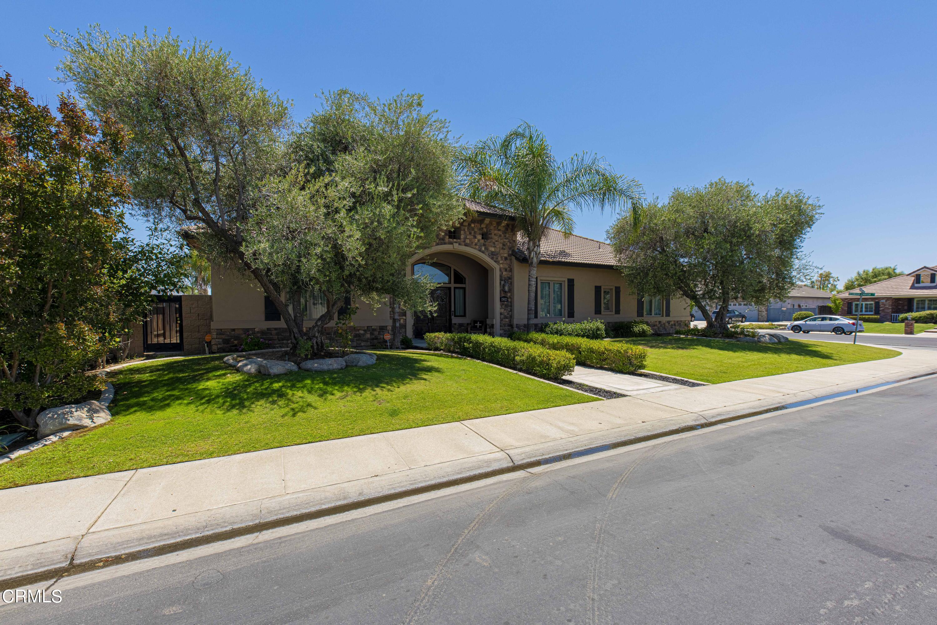 15023 Redwood Pass Drive Bakersfield, CA 93314 - Photo 4 of 67 a view of outdoor space yard and swimming pool