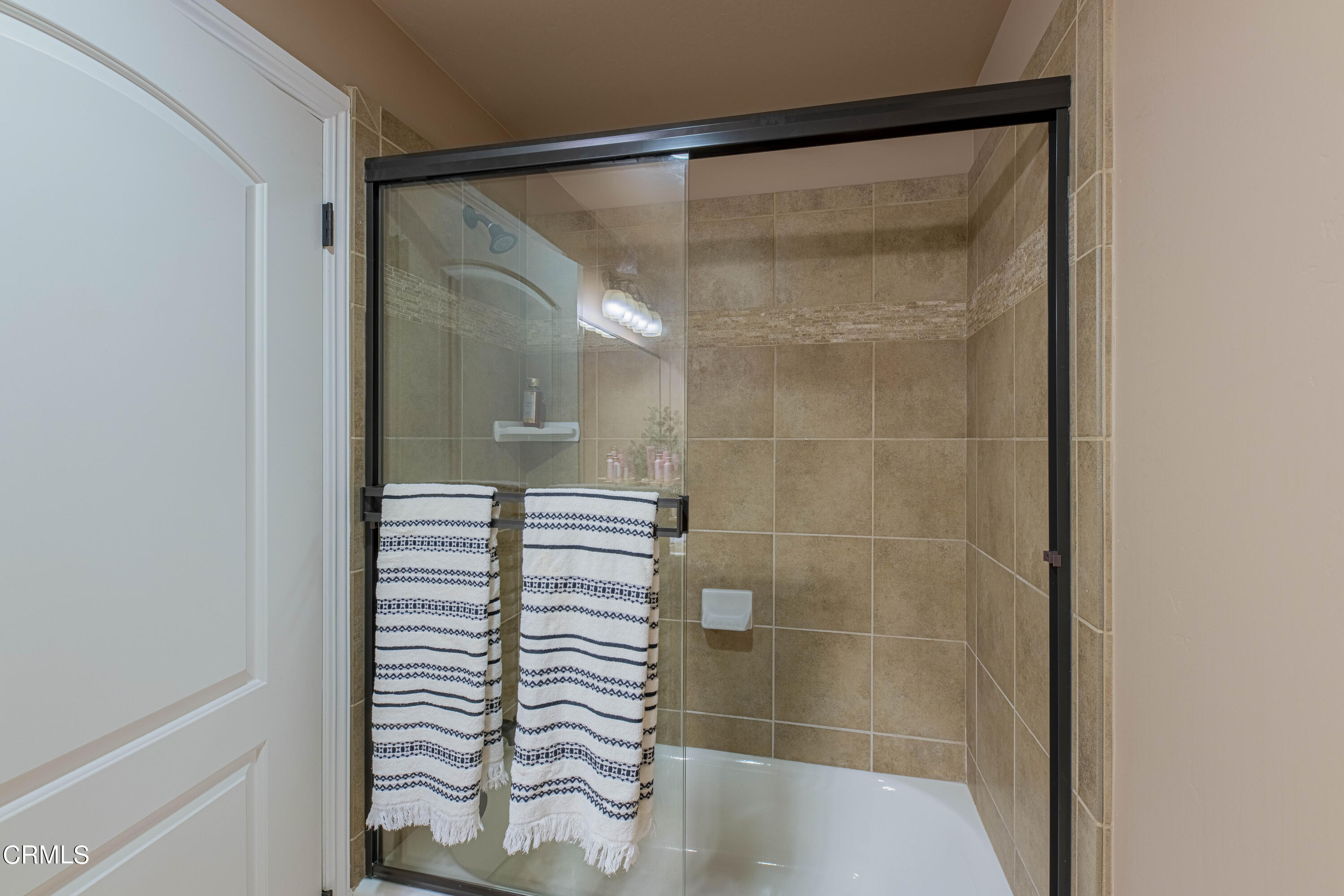 15023 Redwood Pass Drive Bakersfield, CA 93314 - Photo 54 of 67 a bathroom with a shower and a sink