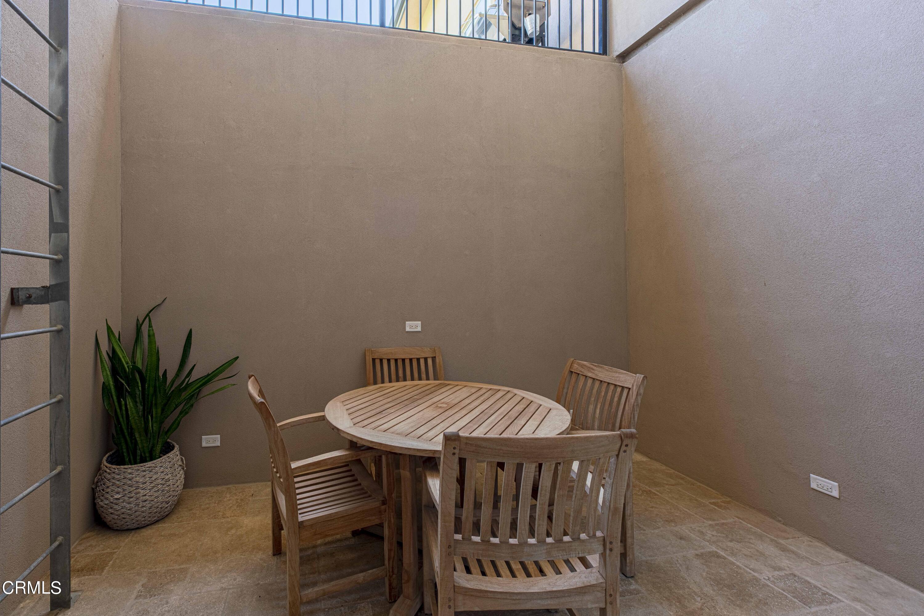 15023 Redwood Pass Drive Bakersfield, CA 93314 - Photo 56 of 67 a view of a room with a table and chairs