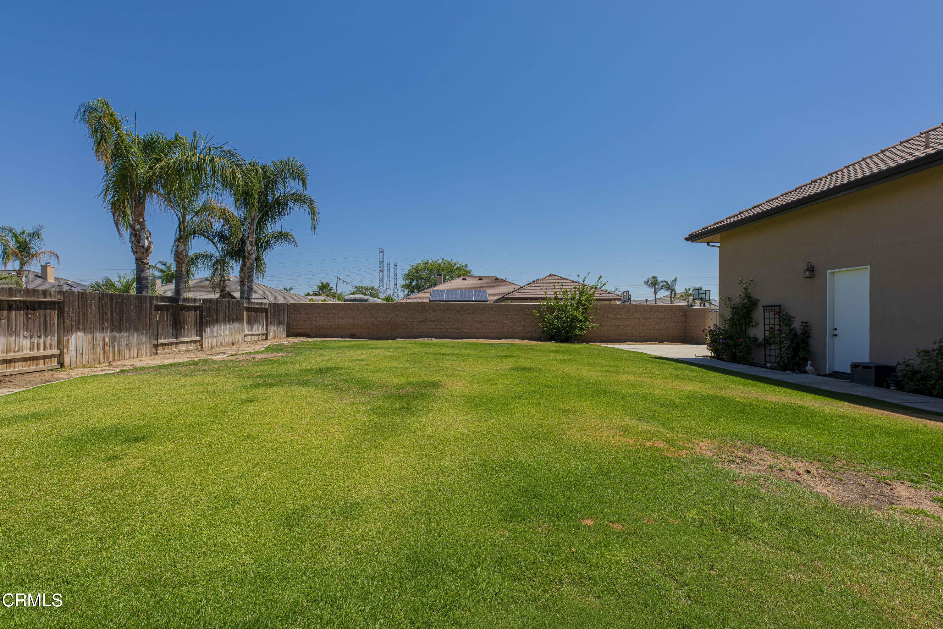 15023 Redwood Pass Drive Bakersfield, CA 93314 - Photo 59 of 67 a view of a backyard with a garden