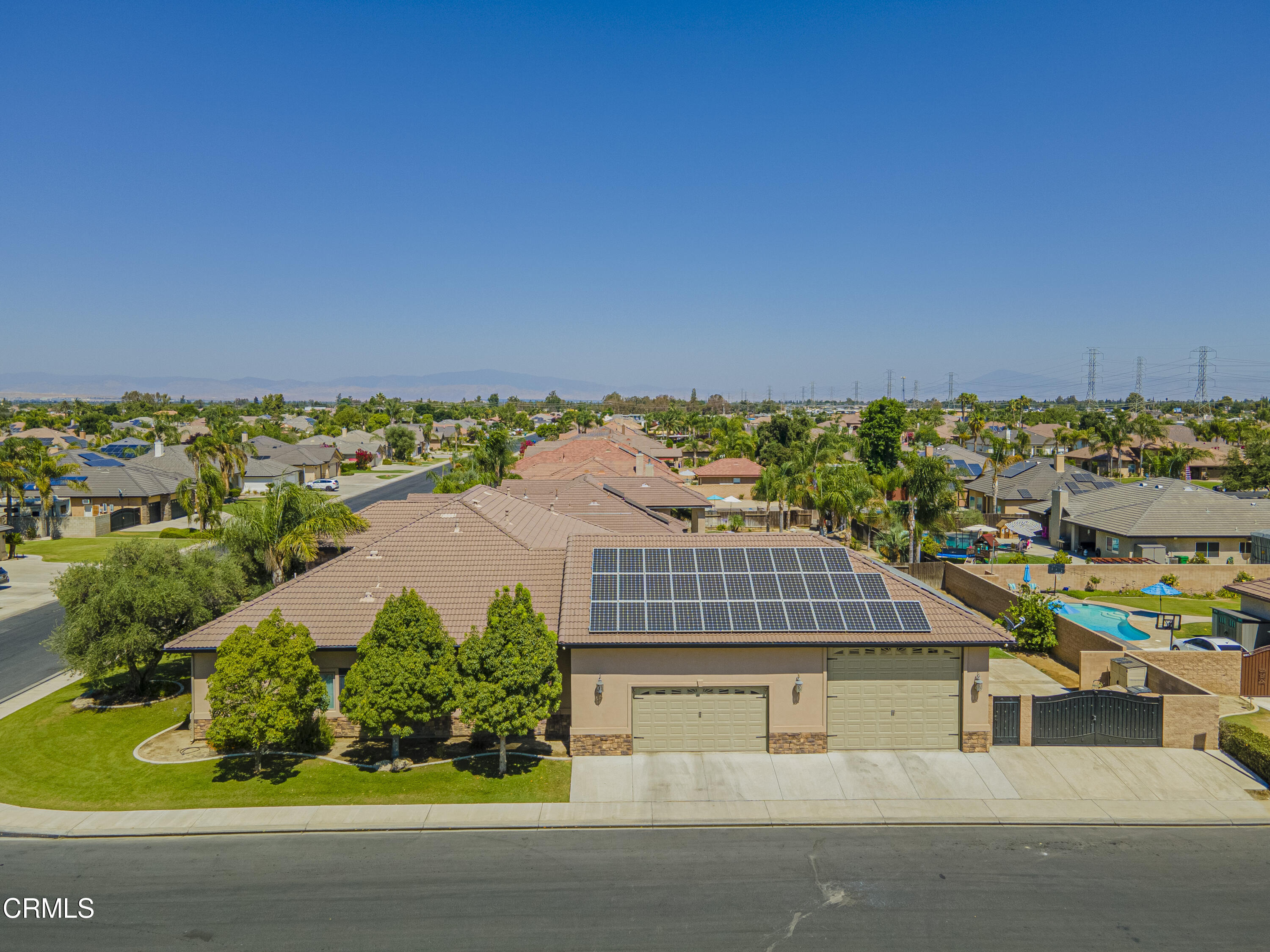 15023 Redwood Pass Drive Bakersfield, CA 93314 - Photo 6 of 67 an aerial view of a house with a yard