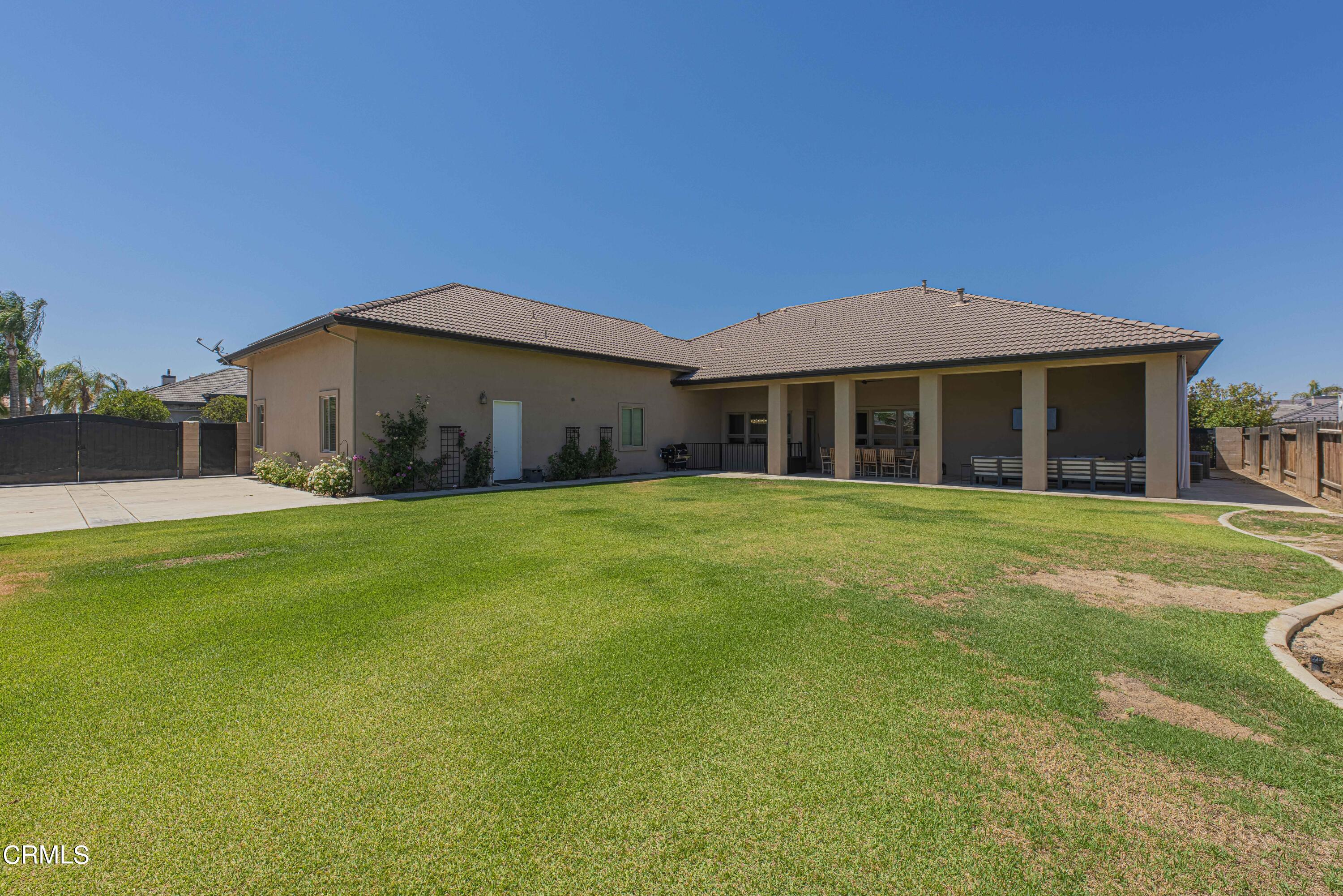 15023 Redwood Pass Drive Bakersfield, CA 93314 - Photo 62 of 67 a front view of house with yard and green space