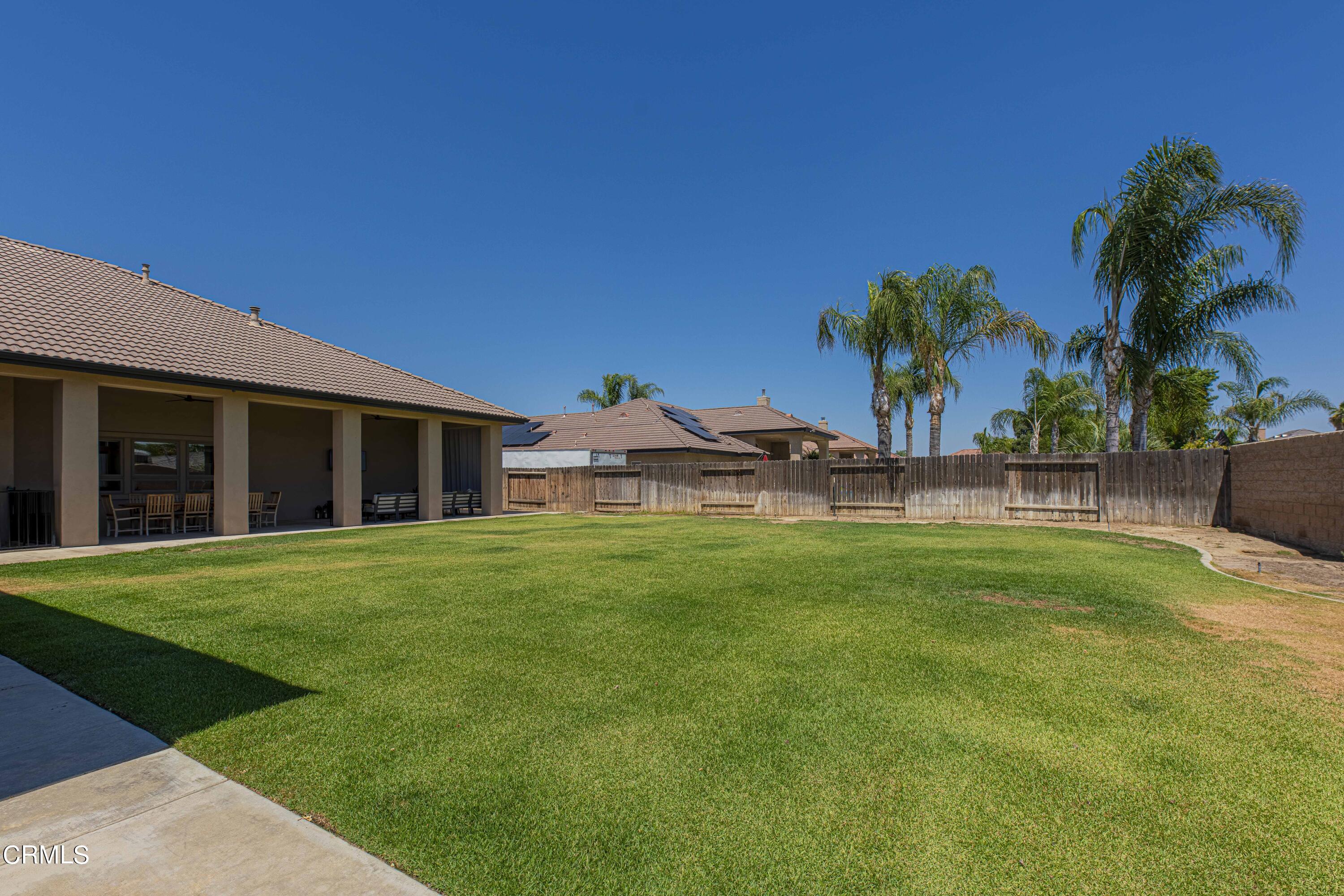 15023 Redwood Pass Drive Bakersfield, CA 93314 - Photo 64 of 67 a front view of a house with a garden