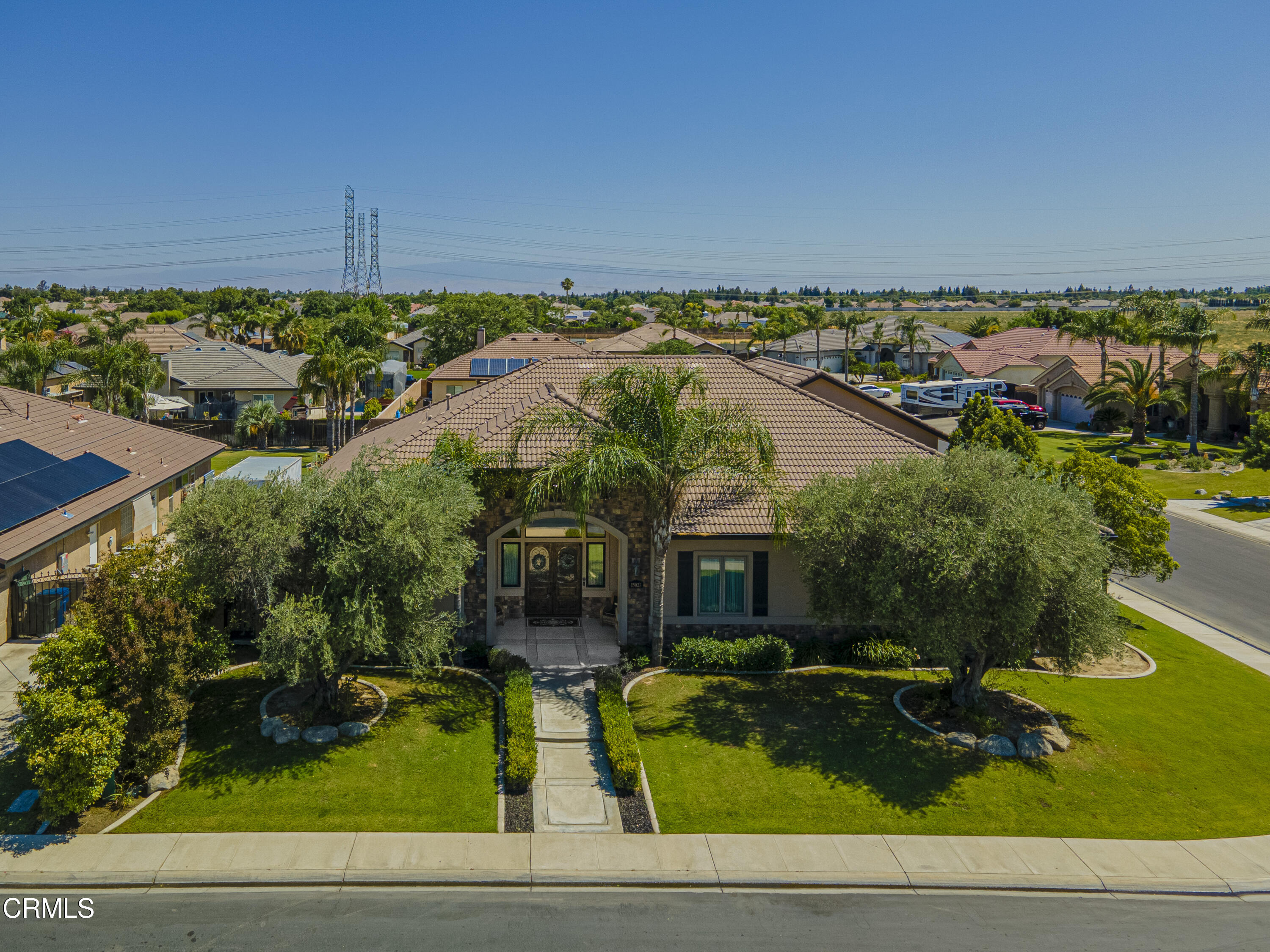 15023 Redwood Pass Drive Bakersfield, CA 93314 - Photo 66 of 67 a front view of a house with garden