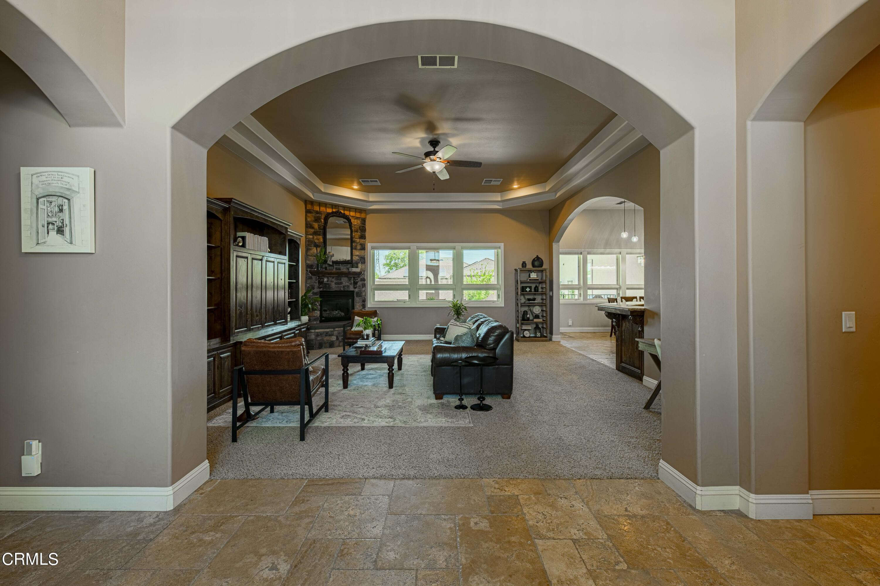 15023 Redwood Pass Drive Bakersfield, CA 93314 - Photo 9 of 67 a living room with furniture and a flat screen tv