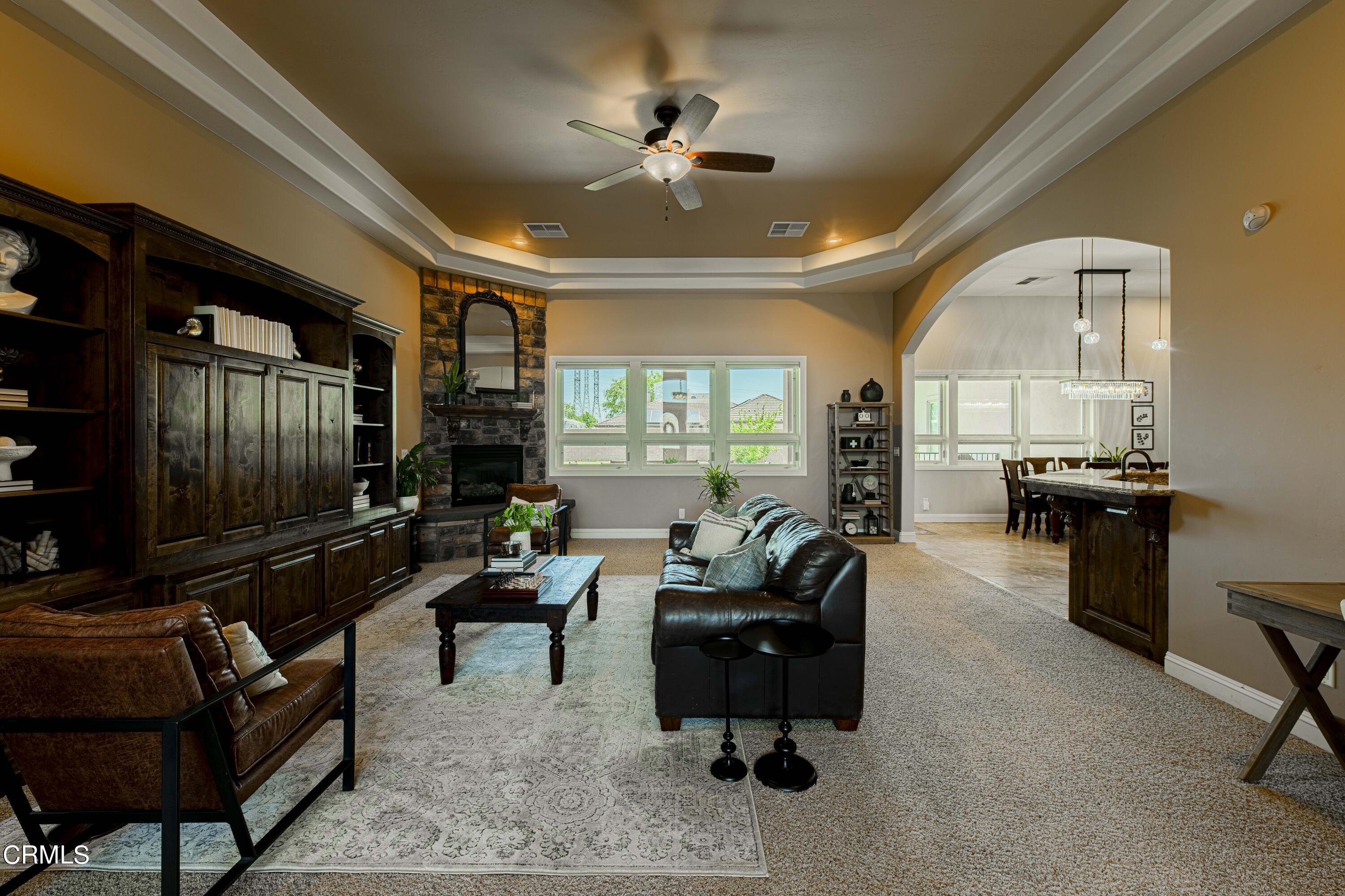 15023 Redwood Pass Drive Bakersfield, CA 93314 - Photo 10 of 67 a living room with furniture and a chandelier