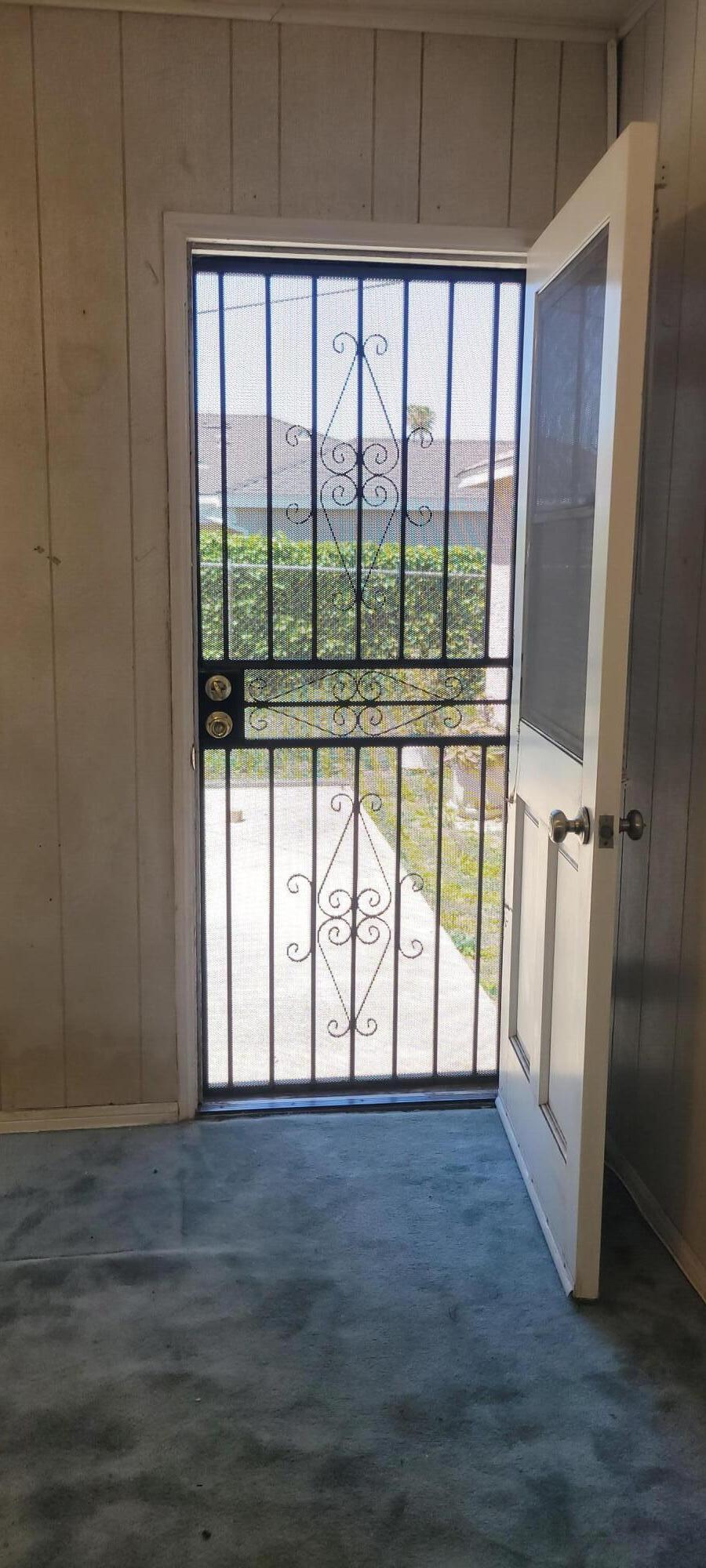 1103 West Bennett Street Compton, CA 90220 - Photo 13 of 20 a view of empty room with wooden floor and fan