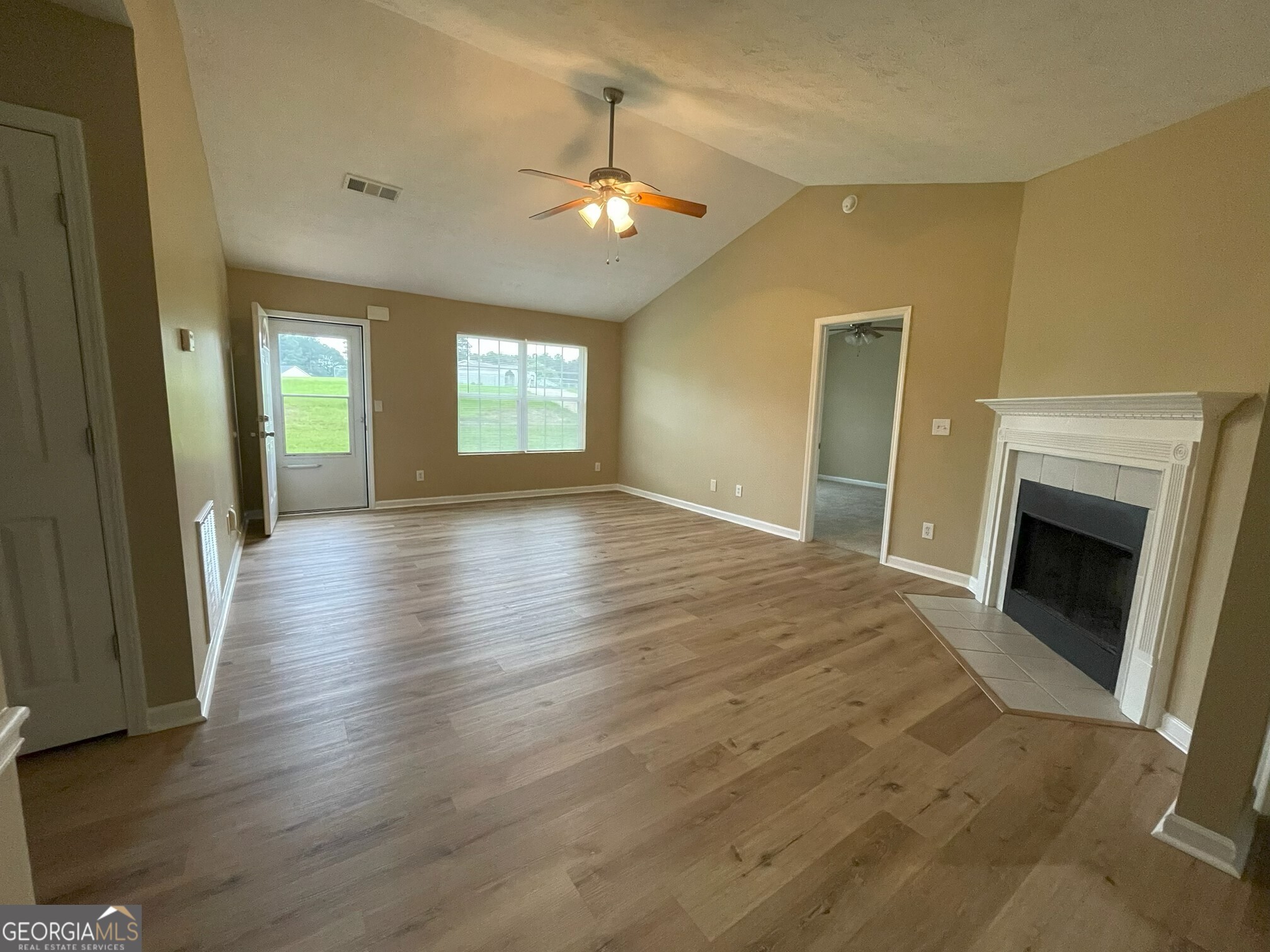 134 Cemetary Road Luthersville, GA 30251 - Photo 14 of 18 a view of an empty room with window and fire place