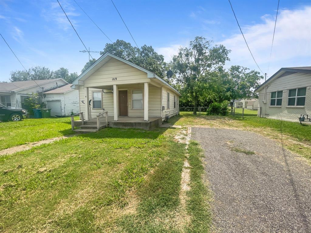 109 South 5th Street Sanger, TX 76266 - Photo 5 of 14 a front view of house with yard and green space