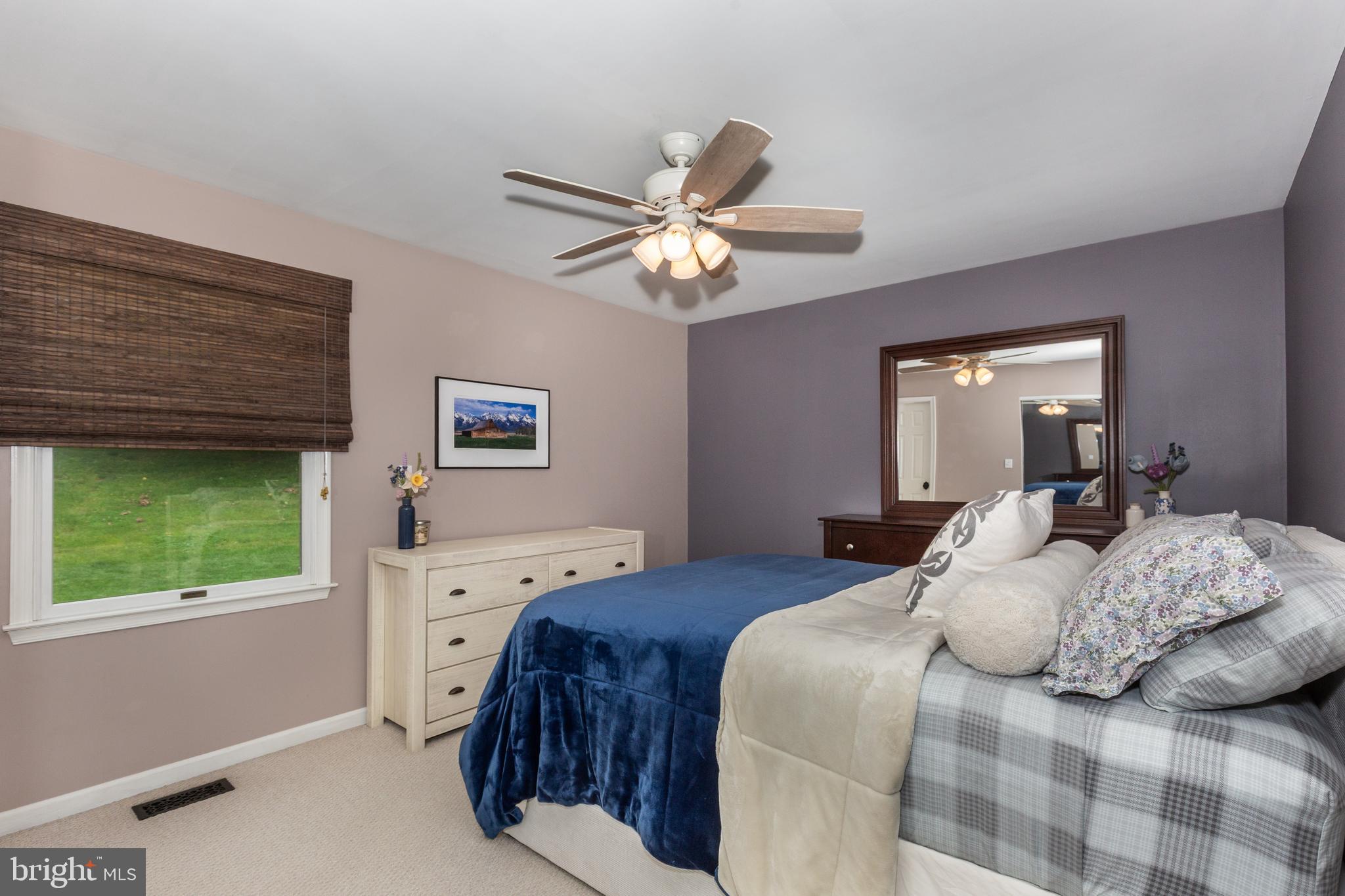 312 Inverness Close Westminster, MD 21158 - Photo 15 of 36 a bedroom with a bed and a window