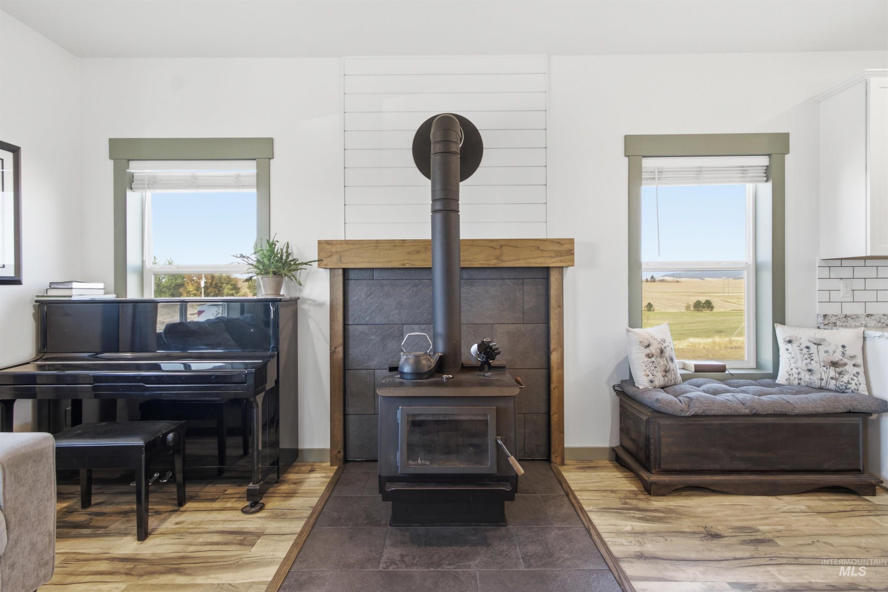 1032 Duffield Flat Road Potlatch, ID 83855 - Photo 47 of 50 Wood-burning stove with a stone tile surround and wood mantel
