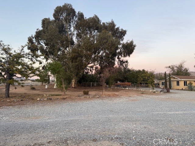 16100 Navajo Road Apple Valley, CA 92307 - Photo 17 of 55 a view of dirt yard with a large tree